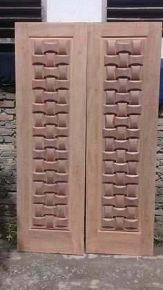 two large wooden doors sitting next to each other