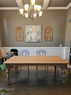 a large wooden table sitting in the middle of a room