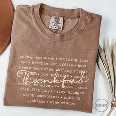 This cute, funny Comfort Colors Thanksgiving shirt is perfect for family reunion dinners or for a Thanksgiving gift for the host with a dry sense of humor! P R O D U C T∙ D E T A I L S   *  Brand:  Comfort Colors   *  Fabric:  100% ring-spun cotton.  Medium weight   *  Fit:  Relaxed fit.  Runs large   *  Your shirts are carefully made with attention to small details ♡     C A R E  ∙ I N S T R U C T I O N S   *  Turn inside out.  Cold water wash with like colors only *  Mild detergent.  Do not bl Funny Long Sleeve T-shirt With Text, Funny Cotton T-shirt For Family Reunion, Custom Text Crew Neck Tops For Family Gatherings, Funny T-shirt With Text For Family Reunion, Funny Text T-shirt For Family Reunion, Funny Tops With Text For Family Reunion, Custom Text Crew Neck T-shirt For Family Gatherings, Friend Thanksgiving, Friendsgiving Shirt