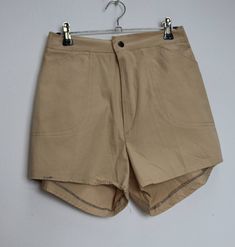 "a vintage pair of cream/beige cotton shorts ✿ IMPORTANT INFORMATION: * excellent vintage condition * size: small - please check exact measurements below (they're there for your benefit!) * garment care: machine washable ✿ MEASUREMENTS (taken while item is lying flat, some measurements will need to be doubled): * waist: 12.5-15\" (32-38cm) - elasticated * hips: 18\" (46cm) * front rise: 12\" (30cm) * back rise: 15\" (38cm) * leg in-seam: 2.5\" (6.5cm) * leg out-seam: 13\" (33cm) * thigh width: 1 Vintage Cotton Cargo Shorts With Pockets, Vintage Cotton Cargo Shorts For Summer, Vintage Cotton Khaki Shorts, High Waist Beige Shorts, Beige High Waist Cotton Shorts, Beige High-waist Cotton Shorts, Khaki Cotton Shorts, Vintage Beige Bottoms With Pockets, Vintage Short Khaki Bottoms