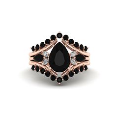 a rose gold ring with black stones and diamonds