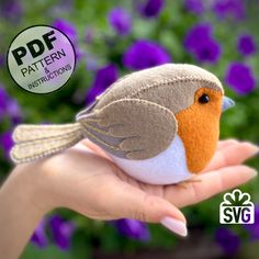 a hand holding a small stuffed bird in front of purple flowers with the words pattern instructions below it