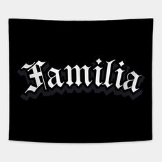 the word familla written in black and white on a black wall hanging tapestry