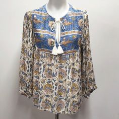 Lucky Brand Long Sleeve Boho Peasant Blouse Women's Size Medium New With Tags Patterned Long Sleeve Boho Print Blouse, Fall Vacation Blouse With Split Neck, Fall Vacation Split Neck Blouse, Split Neck Blouse For Fall Vacation, Bohemian Long-sleeve Blouse With Boho Print, Multicolor Bohemian Tunic Peasant Top, Folk Style Boho Print Tops For Vacation, Beach Peasant Top With Boho Collar, Bohemian Multicolor Peasant Tunic Top