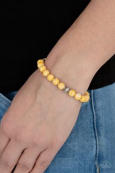 Swirling with yellow details, earthy white beads and faceted silver accents are threaded along a stretchy band around the wrist for a tranquil look. Sold as one individual bracelet. Paparazzi Accessories Jewelry, Stretchy Beaded Bracelet, Colorful Frames, Yellow Bracelet, Ball Necklace, Jewelry Images, Paparazzi Accessories, White Rhinestone, Stretchy Bracelets