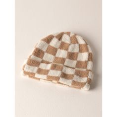 Spruce up your cold weather accessories in Shiraleah's Tanner hat. This hat features a cozy knit texture, in a checkered tan and ivory design making it the perfect addition to any winter outfit. Made from nylon the Tanner hat will keep you cozy and chic during the cold winter months. Pair it with other Shiraleah accessories to complete your winter look. Checkered Black And White, Round Top Collection, Tan Hat, Checkered Design, Knit Texture, Elegant Baby, Animal Books, Handbag Charms, Vase Candle Holder