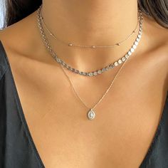 Step up your necklace stack with this simple and oh so chic Bead Station choker chain necklace. Perfect for layering, this charm choker necklace adds a an extra bit of dimension to any outfit. Details:• 18k Gold Plated or E-Coated Sterling Silver• Length: Adjustable from 12" to 15" • Lobster Clasp Stackable Silver Necklace, Necklaces Silver Layered, Necklace Combinations Silver, Everyday Necklace Stack Silver, Simple Silver Necklace Stack, Silver Necklace Stack Dainty, Silver Stacking Necklaces, Silver Necklace Combo, Layer Necklaces Silver