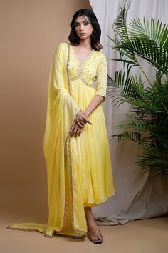 Bright yellow anarkali with moti, zardosi, zari hand embroidery on front yoke and sleeves. Paired with a straight palazzo and a dupatta with hand embroidered lace and moti border. - Aza Fashions Designer V-neck Anarkali Set With Resham Embroidery, Anarkali Set With V-neck And Dupatta, Traditional V-neck Anarkali Set With Dupatta, V-neck Wedding Dress For Diwali, Anarkali V-neck Sharara For Festive Occasions, V-neck Anarkali Set For Diwali, Festive Bollywood Anarkali Set With V-neck, Unstitched Traditional Anarkali Set With V-neck, Festive Anarkali Salwar Kameez With V-neck