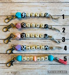 four personalized keychains with the words love, mama, and mom written on them