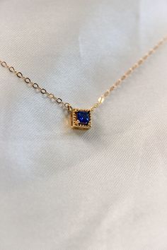 PRODUCT DESCRIPTION Chic and sophisticated, this Diane Necklace is inspired by the glamour of bygone eras. This opulent piece is crafted in 18k Gold-plated or 14k Gold-filled with metal and features a blue square-cut cubic zirconia pendant. Effortlessly elegant and pairs beautifully with day and evening ensembles. You are fine to shower in our gold-filled jewelry. Get it wet, wear it for life! A Dainty yet Elegant Necklace Water and Tarnish Resistant 14k Gold-filled with jeweler's brass (at leas Fine Jewelry With Rectangular Pendant For Formal Occasions, Fine Jewelry With Birthstone For Party, Formal Gold-plated Birthstone Necklace, Fine Jewelry Birthstone For Party, Dainty Sapphire Jewelry With Diamond Accents, Formal Birthstone Necklace Fine Jewelry, Dainty Gemstone Birthstone Necklace For Formal Occasions, Elegant Rectangular Pendant Jewelry For Anniversary, Formal Dainty Birthstone Necklace With Gemstones