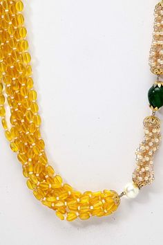 Product Features: Color: Yellow Material: Copper Work: Pearls, Natural Stones, Faux emerald Length of Necklace: 65 CM Width of Necklace: 2.54 CM Adjustable: No Occasion: Casual Disclaimer: There will be slight difference in digital to actual image Green Faceted Beads Necklaces For Festivals, Green Faceted Beads Necklace For Festivals, Green Oval Beaded Chain Jewelry, Traditional Yellow Gemstone Beads Necklace, Green Beaded Pearl Necklace For Celebrations, Gold Emerald Necklace With Round Beads For Festive Occasions, Celebration Green Beaded Pearl Necklace, Green Polished Beads Necklaces For Festivals, Green Polished Bead Necklaces For Festivals