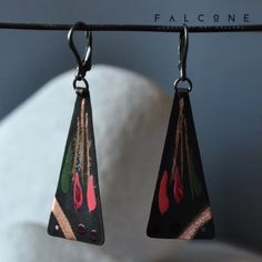 Earrings handmade from copper and silver. Copper dyed black with a matte finish. Decorated with engraved streaks and stripes, which form a pattern on the fish. Complemented by streaks in pudding pink, dark maroon and moss green. Striking and unusual.  Closing earwires made of 925 sterling silver. The width of the fish is about 2 cm (ca. 0.79in). Their length is about 4 cm (ca. 1.57in). The length of the whole earrings is about 6 cm (ca. 2.36in). The last photo shows examples of the packaging in which we ship our original jewelry. falcOneGALLERY Newsletter ❤️ Join our newsletter to get news about the latest products and promotions. 🖋️ https://subscribepage.io/falcOneGalleryEtsy Artisan Patina Earrings As A Gift, Artisan Earrings With Patina For Gifts, Artisan Earrings With Patina As Gift, Metal Earrings With Patina For Gift, Patina Metal Earrings As A Gift, Artistic Black Nickel-free Earrings, Hand Painted Black Earrings For Gift, Patina Drop Earrings As Gift, Handmade Black Copper Earrings