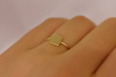 14 k yellow gold square id ring / stackable yellow gold dainty ring / delicate ring square engravable ring . Free shipping in the USA Handmade AND HAND ENGRAVED. SIMPLE AND DELICATE SOLID 14k GOLD SIGNET RING. THIS RING IS 14 K YELLOW GOLD BUT ALSO AVAILABLE IN WHITE GOLD OR ROSE GOLD . THE TOP SQUARE PLATE IS 4 MM. THE RING ITS SELF IS 1 MM . I CAN ENGRAVE A LETTER ON TO IT. EVERY RING SIZE IS AVAILABLE. A GREAT ADDITION TO A SIMPLE STACKABLE SET . METAL: 14 K YELLOW GOLD 585 SHIPPING TIME : 7 Minimalist Gold Princess Cut Rings, Minimalist Square Signet Ring Gift, Yellow Gold Square Rings For Anniversary, Minimalist Initial Rectangular Promise Ring, Square Yellow Gold Rings For Anniversary, Minimalist Rectangular Initial Promise Ring, Square Yellow Gold Anniversary Rings, 14k Gold Square Cut Ring For Gift, Minimalist 14k Gold Square Cut Jewelry