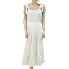 264756 Guaranteed 100% Authentic & Never Before Worn Description: Square Neck Sleeveless Ruffle & Tiered Detail Zipper On Side Measurements/Item Details Size - Medium Bust - 17"Across (Laying Flat) Waist - 15.5"Across (Laying Flat) Length - 51"Approx Color - White Fabric - Cotton Please Note: This Item Is New Without Tags, Labels & Wash Care. White Tiered Sleeveless Summer Dress, White Sleeveless Tiered Dress For Summer, White Tiered Sleeveless Dress For Summer, White Tiered Dress With Tie Straps, Elegant White Sundress With Ruffled Straps, Chic White Maxi Dress With Tie Straps, White Dress With Tie And Ruffled Straps, Sleeveless Linen Maxi Dress With Ruffles, Sleeveless Cream Linen Dress