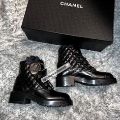 Chanel Combat Boots Quilted Lace Up Interlocking Cc Logo Condition: New In Box With Dust Bag Size: Women’s Us 7/ Eu 37 Color: Black With Gold Tone Hardware Material: Calfskin & Metal Authentic, Please Feel Free To Look At All My Reviews Given By Other Buyers. Rest Assured That If You Purchase This, Poshmark Authenticates Anything Over $500. It Will Get Sent Out To Poshmark Headquarters To Get Authenticated, And Once They Authenticate It, The Authenticators Will Ship It Out Directly To You. Pleas Luxury Ankle-high Boots With Lug Sole, Luxury Boots With Leather Sole And Closed Toe, Luxury Lace-up Boots With Lug Sole, Luxury Lace-up Patent Leather Boots, Designer Ankle-high Boots With Lug Sole, Luxury Round Toe Boots With Branded Insole, Luxury Boots With Round Toe, Designer Ankle Boots With Studded Rubber Outsoles, Luxury Calf Leather Boots With Flat Heel