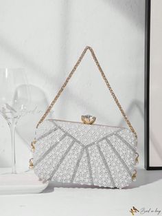 Bird in Bag - Elegant Pearl-Embellished Clutch Bag for Ladies: A Perfect Accessory for Evening Parties, Weddings, Proms, and Formal Events - Complete with Metal Chain Handle for Ease and Style. Complements Party Dresses, Formal Gowns, and Cocktail Attire. White Rectangular Evening Bag For Banquet, Glamorous Embellished Evening Bag For Events, Silver Embellished Bags For Events, Elegant Embellished Evening Bag, Elegant Pearl White Party Clutch, Elegant White Party Bags, Embellished Clutch For Banquet, Embellished Rectangular Evening Bag For Prom, White Evening Bag With Pearl Embroidery For Party