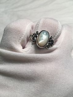 Lovely polished 925 sterling silver has the look of white gold set with a huge white Mother Of Pearl set in very detailed vintage filigree Size 7, 8, 9, 9.25 and 10 All rings are shipped free in the US in a nice gift box. Check out our over a THOUSAND great reviews Engraving is $4 per letter and is not always perfect depending on the piece. It can take a few days if the jeweler is busy. This is payable to Paypal Judithsltd@gmail.com Elegant Moonstone Cabochon Ring For Anniversary, Elegant Cabochon Moonstone Ring For Anniversary, Victorian Style Pearl Ring Gift, Victorian Pearl Ring Gift, Victorian Pearl Ring Gemstone Gift, Victorian Pearl Ring With Gemstone For Gift, Elegant White Gold Moonstone Ring In Sterling Silver, Elegant Moonstone Ring In White Gold Sterling Silver, Antique White Moonstone Wedding Ring