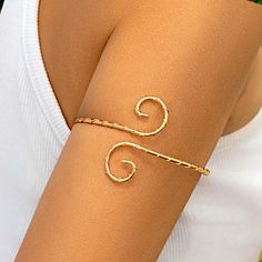 🎄Please order by December 10th to ensure the best chance for you to receive your item before Christmas!🎄 Its minimalist design and adjustable fit make it a versatile accessory for any occasion.  Crafted with care, this arm cuff adds a touch of bohemian chic to your style. Material: - Iron Alloy, Gold Plating  Size:  - 8cm width x 5cm Length  Key Features: - Unique Spiral Design - Adjustable Fit - Lightweight & Comfortable My family has dedicated over 8 years to crafting quality products. Every Upper Arm Cuff, Arm Cuff Bracelet, Upper Arm Cuffs, Spiral Design, Arm Cuff, Body Jewellery, Bohemian Chic, Minimalist Jewelry, Arm Band