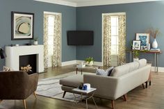 a living room with blue walls and furniture