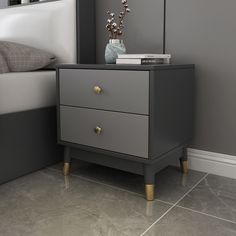 a bedroom with grey walls and white bedding has a nightstand with two drawers on each side