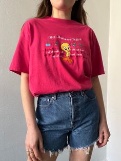 Pink 100% cotton crew neck t-shirt with Tweety Bird stitched on the front along with various text under "High Maintenance Checklist". In excellent vintage condition. DETAILSLabel: Warner Bros.Material: 100% Cotton SIZE & MEASUREMENTSTag Size: Large Length: 28"Bust: 42"Waist: 42"Sleeve: 7"Shoulder: 20.5" High Maintenance Checklist, Retro Cotton T-shirt With Embroidered Graphics, Vintage Short Sleeve T-shirt With Text Print, 90s Style Crew Neck Cotton Shirt, 90s Cotton Tops With Embroidered Graphics, Vintage Short Sleeve Tops With Text Print, 90s Embroidered Cotton Tops, Vintage Cotton T-shirt With Embroidered Graphics, Pink T-shirt With Embroidered Graphics For Streetwear