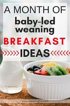 a white bowl filled with fruit next to a glass of milk