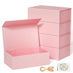 the pink box is open and ready to be used as an office supply unit for crafting