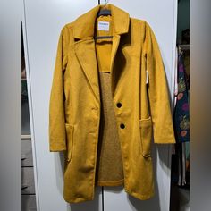 Yellow Old Navy Trench Coat. Womens Small Gold Single-breasted Winter Outerwear, Yellow Winter Outerwear With Button Closure, Trendy Yellow Outerwear With Button Closure, Casual Yellow Outerwear For Fall, Yellow Fall Blazer, Trendy Yellow Long Sleeve Outerwear, Gold Outerwear For Work In Spring, Yellow Button-up Casual Outerwear, Yellow Casual Button-up Outerwear