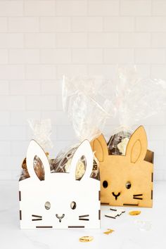 two boxes filled with cookies and some bunny ears