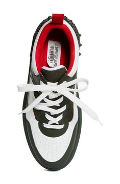 A '90s-inspired street-savvy silhouette that borrows from basketball and skate shoes of the era defines this mixed-media sneaker bristled with signature spikes. Lace-up style Removable insole Leather and textile upper/textile lining/synthetic sole Imported Designer Shoes Sporty Lace-up Basketball Shoes With Studded Outsoles, High-top Chunky Sneakers With Perforations For Streetwear, Spiked Lace-up High-top Sneakers For Streetwear, Sporty Low-top Basketball Shoes With Studded Outsoles, Sporty Skate Shoes With Studded Rubber Outsoles, Casual Chunky Sneakers With Perforations For Streetwear, Casual Chunky Perforated Sneakers For Streetwear, High-top Chunky Sneakers With Perforated Toe Box For Streetwear, Low-top Chunky Sneakers With Perforations For Streetwear