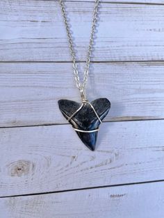 Wire Wrapped Shark Tooth found in Florida‼️ Paired with an 18 inch or 20 inch chain of your choice (925). Hand crafted with love and care✨ Wrapped in Sterling Silver plated wire!! Each hand found off the Coast of Florida.  Every hand picked tooth will be different in color and size!  Each are unique and 2 will never look exactly alike.😋 All Sales are final ❤️ If you have any questions, please feel free to message me! Thanks for viewing my jewelry, check out the rest of my fossil and sea glass j Handmade Sterling Silver Arrowhead Necklace, Arrowhead Wire Wrapped Necklaces For Gifts, Wire Wrapped Arrowhead Necklace For Gift, Adjustable Arrowhead Necklace Gift, Minimalist Wire Wrapped Charm Necklaces As Gift, Minimalist Wire Wrapped Charm Necklace Gift, Minimalist Wire Wrapped Charm Necklace For Gift, Handmade Arrowhead Jewelry Gift, Silver Jewelry With Lobster Clasp For Best Friend Gift