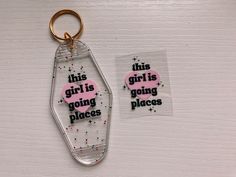 this girl is going places acrylic keychain with pink heart on it