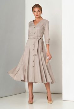 A classic elegant dress with a fitted silhouette, V-neck and 3/4 sleeves. Includes a belt. Material: costume linen Made in Europe Formal V-neck Linen Dress, Elegant Beige Half-sleeve Dress, Elegant Beige Half Sleeve Dress, Half Sleeve Dresses With Button Closure, Fitted V-neck Linen Dress With Buttons, Elegant Belted Linen Dress, Elegant Long Sleeve Linen Dress, Elegant Formal A-line Linen Dress, 3/4 Length Summer Dresses For Work