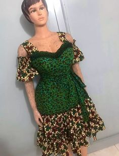 This African Print BEADED Dress is of high quality and is very comfortable and stylish   All clothings are lined 100% cotton, no stretch. Dress size is SIZE 12/14 UK and is 44 inches  long  Handmade in Nigeria WASHING INSTRUCTIONS   Hand wash separately using a mild detergent and cold water. Press on reverse side with a cool iron. Do not machine wash. Do not bleach. Green Cotton Short Sleeve Mini Dress, Green Cotton Mini Dress With Short Sleeves, Green Ruffled Cotton Mini Dress, Green Cotton Mini Dress With Ruffles, Green Cotton Floral Print Dress, Green Floral Print Cotton Dress, Green Floral Print Cotton Mini Dress, Green Cotton Short Sleeve Dress, Green Cotton Dress With Ruffles