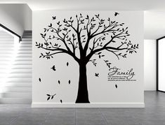 the family tree wall decal is shown with birds flying around it and leaves blowing in the wind