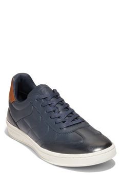 This soccer-inspired sneaker is lightweight and flexible with an anatomical sockliner and padding in the heel for exceptional fit and comfort. Lace-up style Cushioned EVA footbed with arch support Leather upper, textile lining & rubber sole Imported Navy Leather Sneakers With Boost Midsole, Navy Leather High-top Sneakers With Branded Insole, Navy Leather High-top Sneakers For Sports, Casual High-top Running Sneakers With Textured Sole, Casual High-top Sneakers With Textured Sole For Running, Navy Sporty High-top Sneakers With Cushioned Footbed, Navy High-top Sneakers With Cushioned Footbed, Sporty Navy Sneakers With Rubber Sole, Navy Sporty Sneakers With Contrast Sole