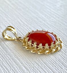 "Large Untreated Mediterranean Red Coral, 14k Yellow Gold Handcrafted Pendant, New* This beautiful pendant has a classic design and features an 10mmx12mm (3.5 ctw), oval, Mediterranean (corralium rubrum) red coral cabochon. This pendant has been handcrafted by our jeweler from solid 14k yellow gold and genuine, untreated, Italian coral. The piece has a quality mark on the bail. This pendant measures 1.04\"x 0.58\" and weighs 2.65 grams. * This pendant will ship in a gift box. * Newly handcrafted Bridal Diamond Jewellery, Coral Pendant, Oval Pendant, Diamond Jewellery, Pandora Bracelet, Gold Jewelry Fashion, Handmade Fashion, Red Coral, Cute Jewelry