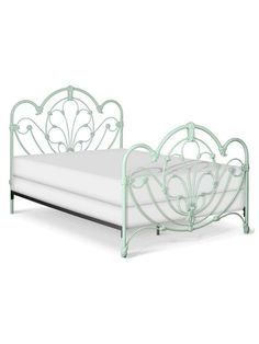 a white bed with a metal frame and headboard on it's side, against a white background