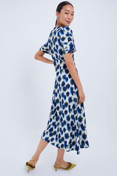 A romantic silhouette in a stand-out printThis eye-catching midi boasts short bell sleeves with pleated detailing and a sleek A-line silhouette. The fresh pattern is a year-round winner, making this perfect for countless occasions. Pair with heels, a clutch, and statement earrings for weddings, cocktail parties, and elevated dinners!Our Favorite Details: Back zip closure Slightly puffed shoulders Seam detailing Material: 93% Rayon, 7% PolyesterCare: Dry cleanAbout the BrandCombining bold colors Chic Printed A-line Midi Dress, Chic A-line Printed Midi Dress, Elegant Printed Short Sleeve Midi Dress, Summer Workwear Midi Dress With Flutter Sleeve, Elegant Short Sleeve Printed Midi Dress, Spring Midi Dress With Pleated Flutter Sleeves, Chic A-line Dress With Abstract Print, Spring Abstract Print A-line Midi Dress, Chic Abstract Print Midi Dress For Evening