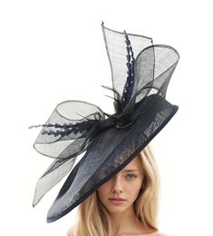 Hats By Cressida Kentucky Derby Ascot Fascinator Hats Black Barn Owl Fascinator Hat Gorgeous extra large navy blue sinamay flat saucer hatinator is trimmed with a black bow and navy blue feathers. This navy blue & black fascinator measures 48cm wide or about 19 inches This headpiece is mounted with a matching headband.   If you prefer a headband to match your hair, please make a note at check out what colour headband you want. Our Barn Owl Saucer Fascinator Hatinator that's perfect for any formal occasion, wedding, horse racing events like the Kentucky Derby, Ascot,Dubai World Cup and Glorious Goodwood.  Featuring an extra large sinamay flat saucer base and sinamay bow, this elegant cocktail hat is ideal for women who want to make a statement at the Epsom Derby,Kentucky Oaks, Preakness or Navy Hat For Spring, Fitted Navy Wide Brim Hat, Navy Fitted Wide Brim Hat, Fitted Party Hat With Structured Crown, Fitted Navy Hat For Kentucky Derby, Fitted Hat With Structured Crown For Party, Elegant Navy Hat For Evening, Elegant Navy Wide Brim Hat, High Crown Fascinator For Royal Ascot Party