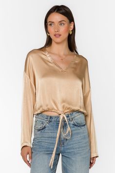 Sadona Sesame Gold Blouse - Tops - Velvet Heart Clothing Chic Long Sleeve Tops With Drawstring, V-neck Tops With Drawstring Tie For Spring, Casual Long Sleeve Blouse With Drawstring, Versatile Long Sleeve Blouse With Tie Waist, Denim Short Dresses, Athleisure Tops, Gold Blouse, Poncho Sweater, Denim Leggings