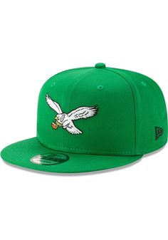 the philadelphia eagles new era 59fifty fitted hat is green with an eagle on it