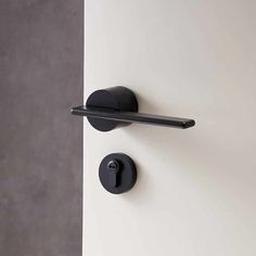 a black handle on a white door