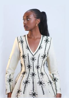 Step into the world of modern Ethiopian fashion with our stunningly unique Habesha Kemis. This contemporary take on the traditional Ethiopian dress combines intricate Habesha embroidery with modern silhouettes and luxurious fabrics, creating a breathtaking fusion of heritage and haute couture. Whether you're attending a cultural celebration or a high-profile event, this dress will make you stand out with its elegance, sophistication, and unmistakable Ethiopian flair. Experience the essence of Et Modern Habesha Dress, Ethiopian Fashion, Habesha Dress, Ethiopian Dress, Habesha Kemis, Cultural Celebration, Design Embroidery, Luxury Fabrics, Black Design