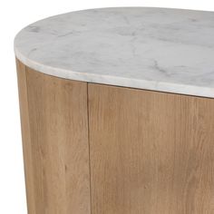 a white marble top on a wooden cabinet