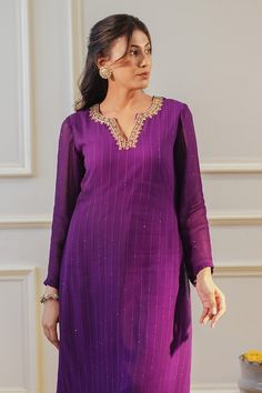 Purple A-line kurta featuring zardozi around the neckline with sequin hand embroidery all over. Paired with a straight pant. - Aza Fashions Elegant Purple Palazzo Set With Resham Embroidery, Elegant Purple Palazzo Set For Festive Occasions, Elegant Straight Kurta Palazzo Set With Cutdana, Elegant Purple Palazzo Set With Zari Work, Elegant Purple Straight Kurta, Elegant Long Sleeve Purple Palazzo Set, Elegant Purple Long Sleeve Palazzo Set, Elegant Purple Chanderi Kurta, Elegant Palazzo Set For Navratri Celebration