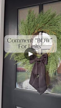 a door with a wreath on it that says comment bow for link'd up