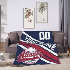 a living room with a couch and baseball blanket