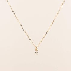 D E T A I L S • Single Chain with charm• 14k Gold Filled• Cubic Zirconia• Tarnish Resistant• Chain Length: 17" + 1" extender M A T E R I A L S •Our Gold filled jewelry has an outer layer of 14k or 18k gold that is pressure bonded to a base metal of jewelers brass. •This type of jewelry is made for everyday use of stacking or layering. • Jewelry can withstand normal body sweat, body oils, and is typically water resistant. J E W E L R Y C A R E Take extra care of your new jewelry to maximize its l Dainty Solitaire Necklace With Cable Chain For Gift, Dainty Cubic Zirconia Cable Chain Necklace, Everyday Delicate Cubic Zirconia Charm Necklaces, Dainty Cubic Zirconia Solitaire Necklace For Everyday, Everyday Solitaire Necklace With Delicate Cubic Zirconia Chain, Dainty Solitaire Necklace With Delicate Chain For Everyday, Everyday Dainty Solitaire Necklace With Delicate Chain, Dainty Everyday Solitaire Necklace With Cubic Zirconia, Dainty Solitaire Necklace With Delicate Chain