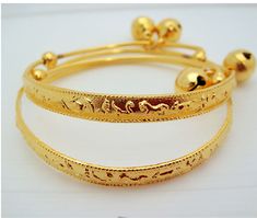 Handmade item from Thailand Materials: Brass, Gold Real 18k & 24K gold plated/Nickel free This is a set of two brand new 23K Thai gold new born anklet bracelet. They measure diameter 4.5-5.5 CM Circumference: 17 CM Adjustable Weight about: 13 grams The anklet can be enlarged so the feet of a baby can insert easily. The round ball is ringing FREE JEWELRY BAG WITH EVERY ITEM Description All gold plated jewelry was sent directly to us from the manufacturer in Bangkok This Unique Jewelry Is Bras Adjustable Gold Bracelet For Ceremonial Occasions, Traditional Gold Anklets With Adjustable Fit, Traditional Gold Adjustable Anklets, Traditional Gold Anklets Adjustable, Adjustable Gold Bracelet For Festive Occasions, Bell Anklet, Elephant Anklet, Crescent Moon Necklace Silver, Hummingbird Jewelry